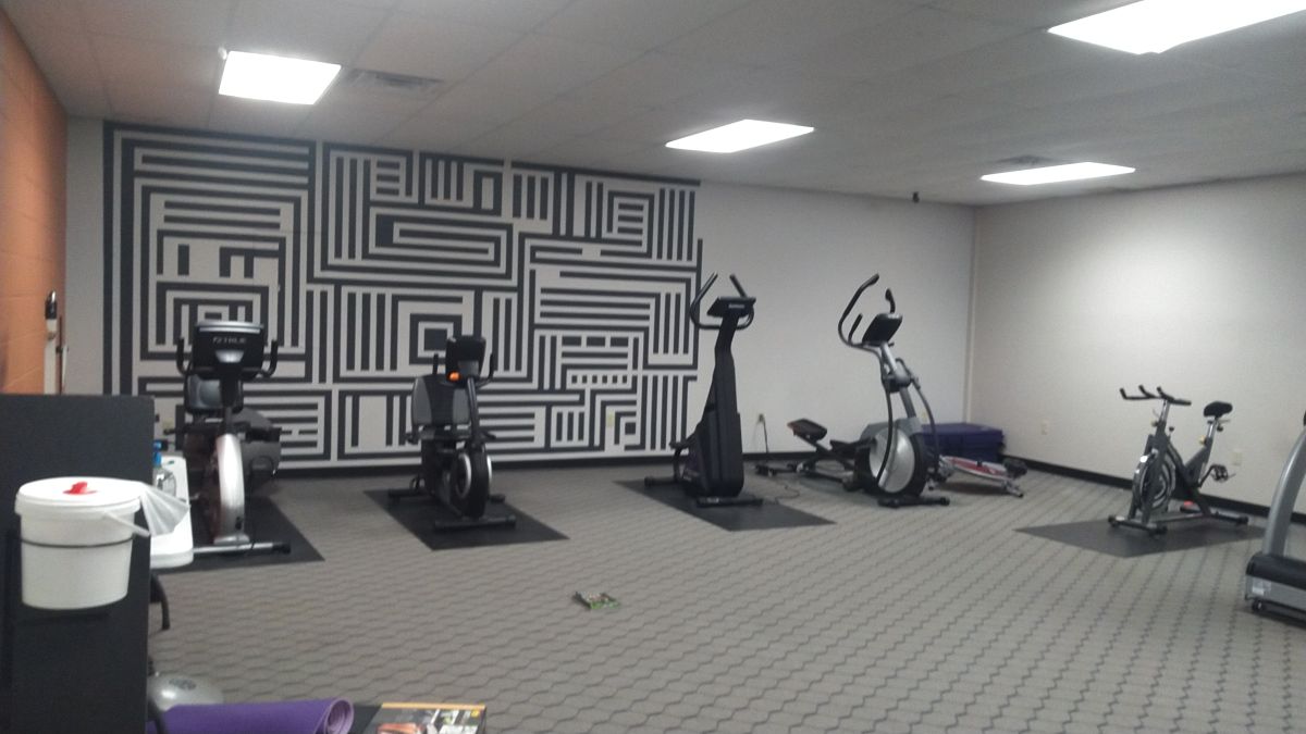 Five exercise bikes in the Dell Gym's weight room