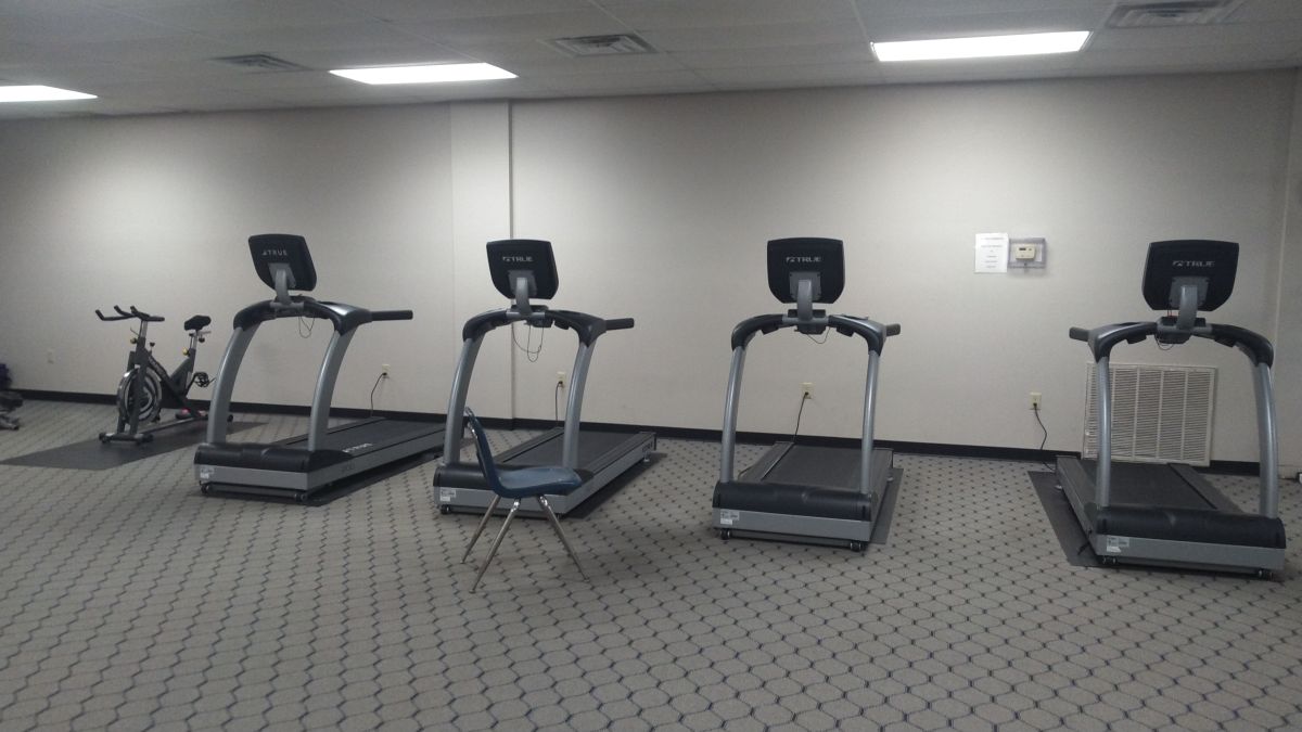 4 treadmills and 1 exercise bike in Dell Gym's Weight Room