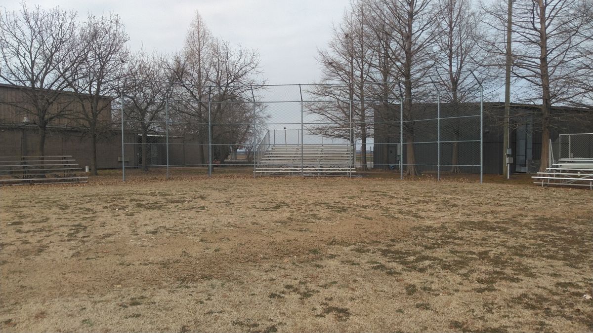 Chainlink barriers and bleachers of the baseball diamond at Dell Park